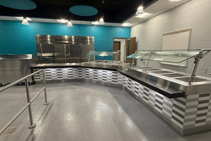 Modern and bright school cafeteria with serving lines