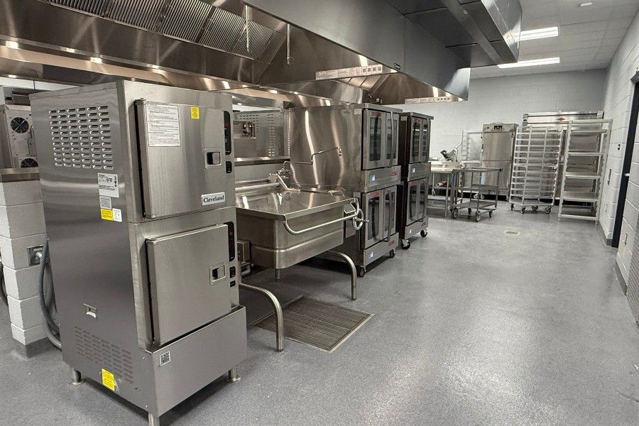 Tilt skillet and other batch cooking equipment in a school kitchen
